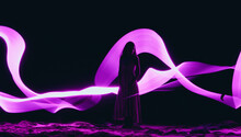 Woman Surrounded By Purple Light