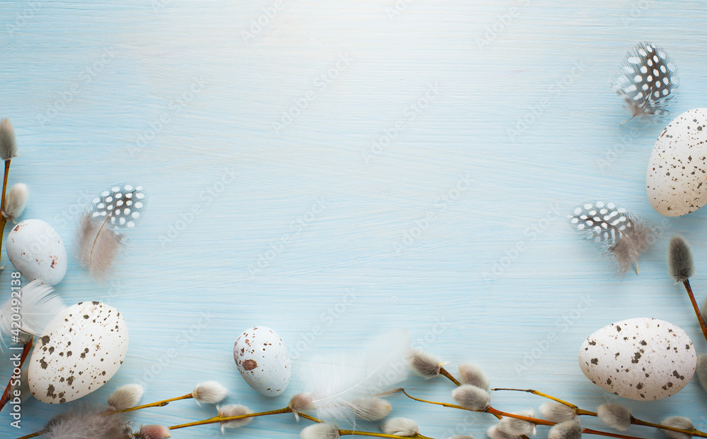 art Tender Easter greetings banner or card background with decoration Easter eggs and pussy willow on blue wooden vintage planks - obrazy, fototapety, plakaty 