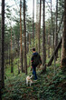 © Boris Jovanovic/Stocksy - Young Man Exploring Forest With His Dog