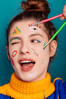 © Painted Wood/Stocksy - Portrait of a young women with makeup
