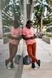 © Mauro Grigollo Photographer/Stocksy - Black man using mobile phone in Miami