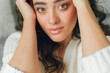 © Kristina89 - Close up beautiful cozy home portrait of a young beautiful curly woman. Spring. Fashion.