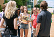 © Sean Locke Photography/Stocksy - Tour: Prospective Female Student And Parent Listen To Guide