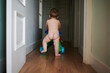 © Guille Faingold/Stocksy - Naked toddler in hallway