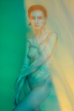 Blurry Portrait Of Young Woman With Bodyart