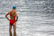 © Tim Booth Photography/Stocksy - Middle aged woman about to swim