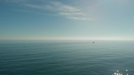 Poster - Smooth seascape waters and ship view during warm sunny day