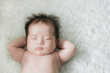 © Maki Company Limited/Stocksy - Cute newborn baby sleeps in white