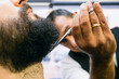 © Inuk Studio/Stocksy - Close-up of barber in process of work