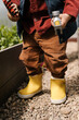 © Alina Hvostikova/Stocksy - Crop boy with tools in hothouse