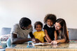 © Nunez Image/Stocksy - Adorable multiethnic Family at Home