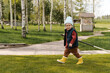 © Alina Hvostikova/Stocksy - Boy with rake in yard