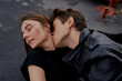 © Tatiana Timofeeva/Stocksy - a couple in love hugs and kisses on the roof