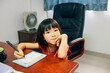© Pansfun Images/Stocksy - Chinese little girl learning to write