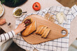 © Alina Hvostikova/Stocksy - Crop child cooking sandwiches in kitchen