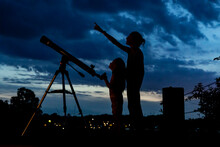 Two Young Girls With Telescope For Science Learning