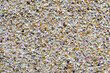 Close Up of an Exterior Wall of Concrete and Small Rocks