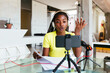 © BONNINSTUDIO/Stocksy - Black teenager studying online at home