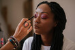 © AD Photography/Stocksy - Make up artist applying make up