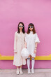 © Pansfun Images/Stocksy - funny portrait of two fashionable women