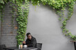 © Hernandez & Sorokina/Stocksy - Man At Coffee Shop Terrace