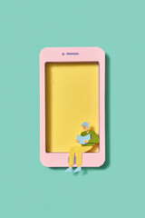 Paper smartphone with reading man student.
