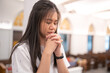 © No-Te - Asian women praying in a Christian church.