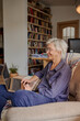 © Tatiana Timofeeva/Stocksy - Active age ageless elderly woman working from home on a laptop