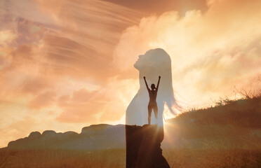 happy woman on a mountain looking up to the sky. letting go of all your mental fears. hope, mental s