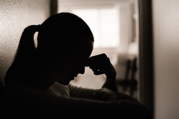 Wall Mural - Sad woman at home feeling tired at stressed 