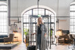 © Hernandez & Sorokina/Stocksy - Woman In The Entrance Of A Hotel