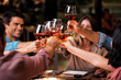 © Nunez Image/Stocksy - Friends Enjoying Dinner at Restaurant