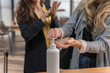 © Hernandez & Sorokina/Stocksy - Anonymous Women Disinfecting Hands