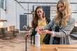 © Hernandez & Sorokina/Stocksy - Travellers In The Reception Disinfecting Hands