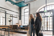 © Hernandez & Sorokina/Stocksy - Two Women Talking In The Hotel Entrance