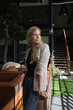 © Hernandez & Sorokina/Stocksy - Businesswoman Holding Mobile Phone Indoors