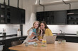 © Hernandez & Sorokina/Stocksy - Two Women Taking Selfie Indoors