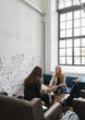© Hernandez & Sorokina/Stocksy - Two Businesswomen Working Together In Cafe