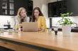© Hernandez & Sorokina/Stocksy - Colleagues Working At Office Kitchen