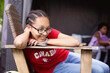 © absphotography/Stocksy - Teenage girls with Canada shirt sitting and smiling happily