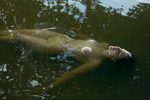 Naked Girl Lies At Water