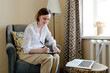 © Sergey Narevskih/Stocksy - Psychologist speaking with online patient