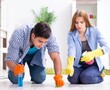 © Elnur - Young family cleaning the house