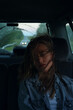 © Danil Nevsky/Stocksy - Female passenger sleeping during road trip