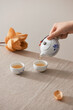 © Maki Company Limited/Stocksy - Tea is poured into the cup closeup