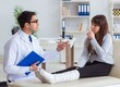 © Elnur - Doctor examining patient with broken leg