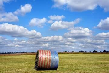 Patriotic Hay Bale All Alone in Field