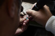 © Floris Productions/Stocksy - Artisan work on jewel close-up, man portrait
