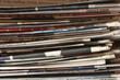 Closeup of newspapers. A stack of discarded, filed, used, old printed newspapers. They are creased and folded and piled high.