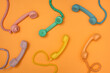 © Pixel Stories/Stocksy - Vinage colorful phone handsets